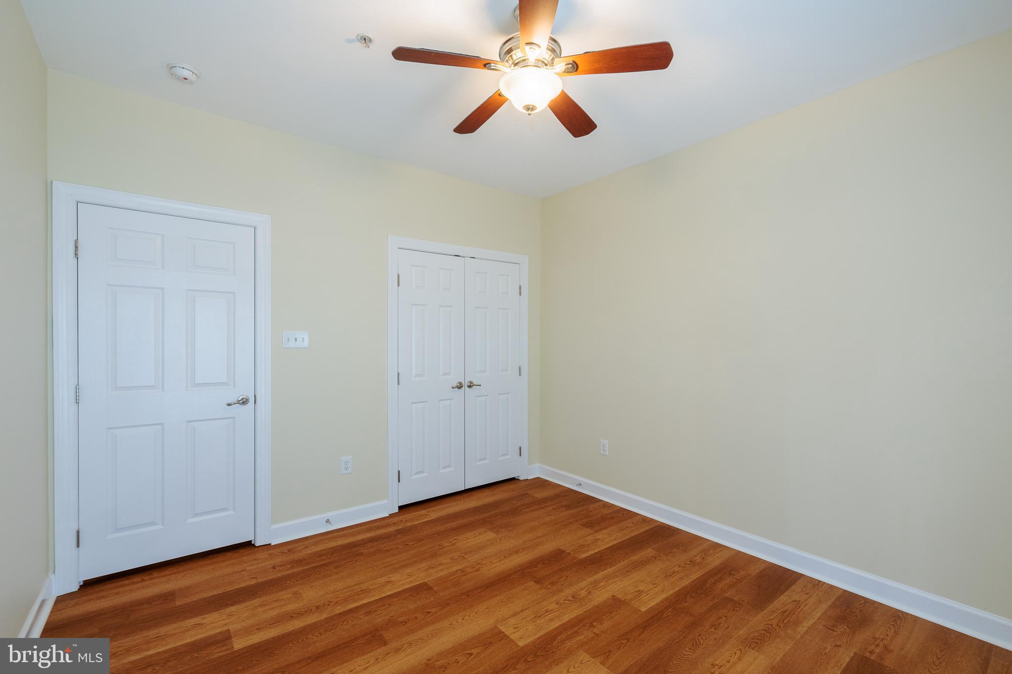 256 Urban Avenue, Unit 256 Gaithersburg, MD 20878 - Photo 37 of 41 an empty room with closet and fan
