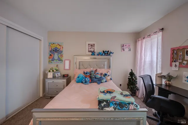 a bedroom with furniture and a bed