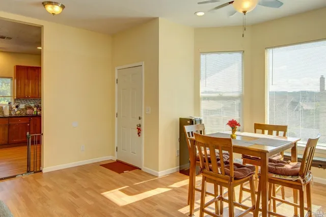 a view of a dining room with furniture and window
