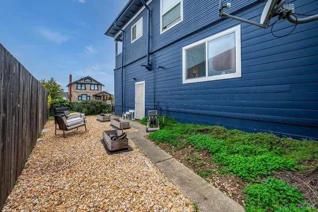 a view of a patio with couches and potted plants