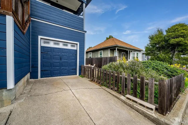 a front view of a house with a garage