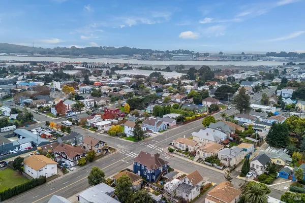 an aerial view of residential houses with outdoor space
