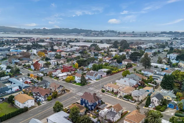 an aerial view of residential houses with outdoor space