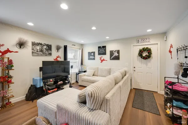 a living room with furniture and a flat screen tv