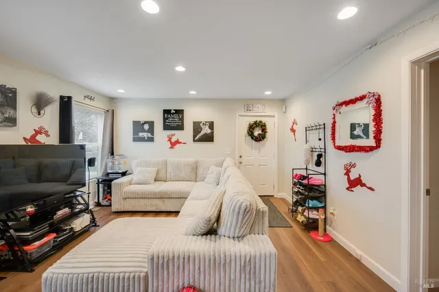 a bedroom with furniture and a flat screen tv