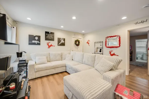 a living room with furniture and a flat screen tv