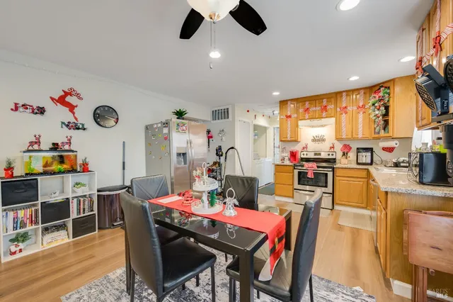 a view of a dining room with furniture window and wooden floor