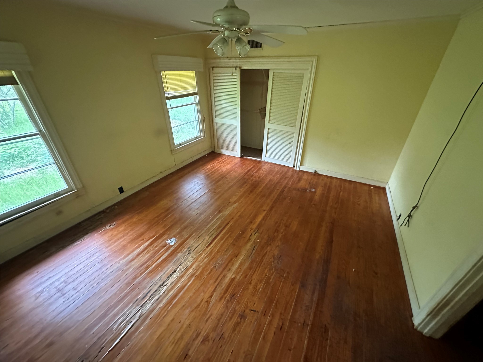 326 Prospect Drive Trinity, TX 75862 - Photo 11 of 22 a view of an empty room with window and wooden floor
