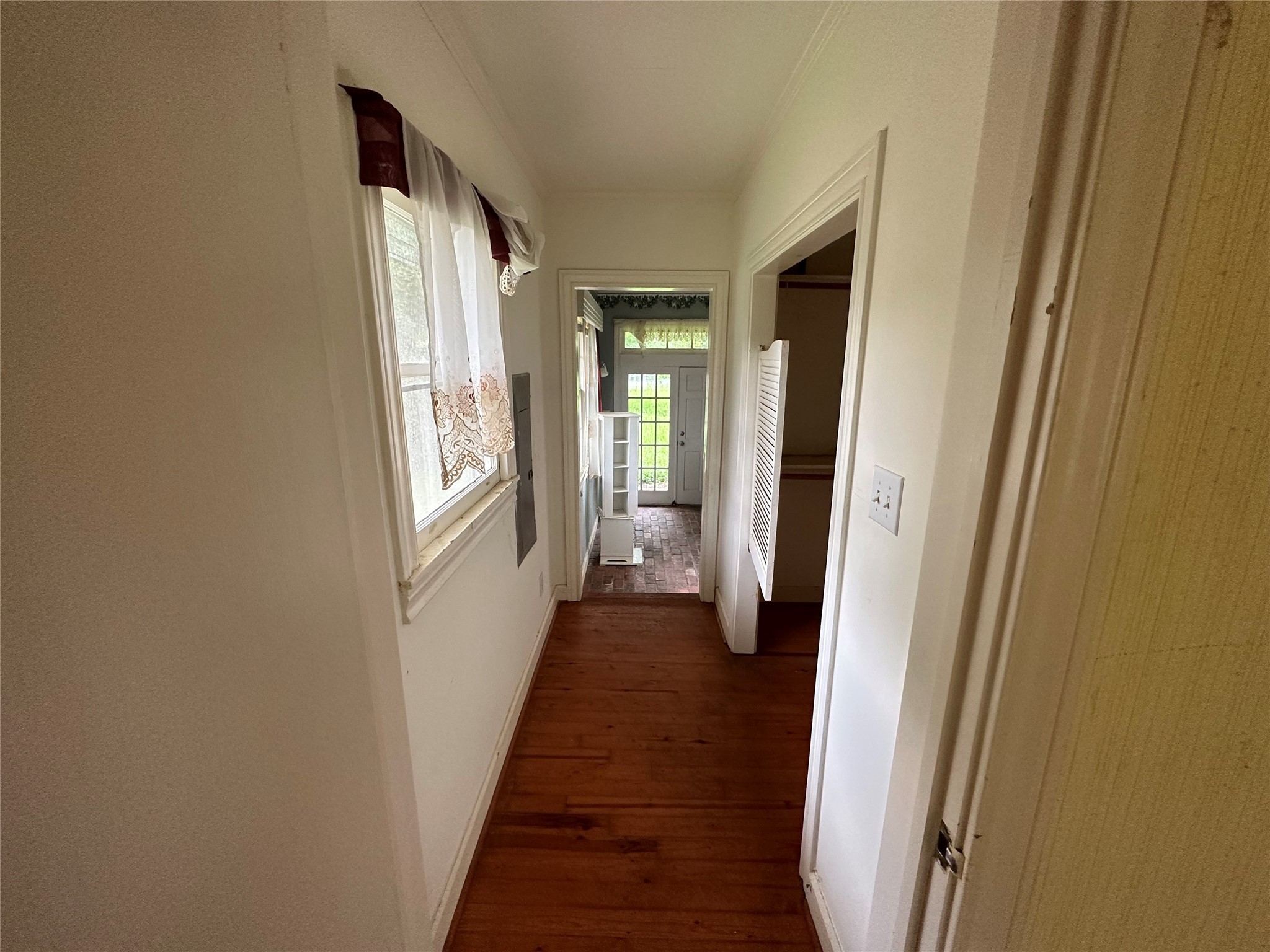 326 Prospect Drive Trinity, TX 75862 - Photo 14 of 22 a view of a hallway with wooden floor and windows