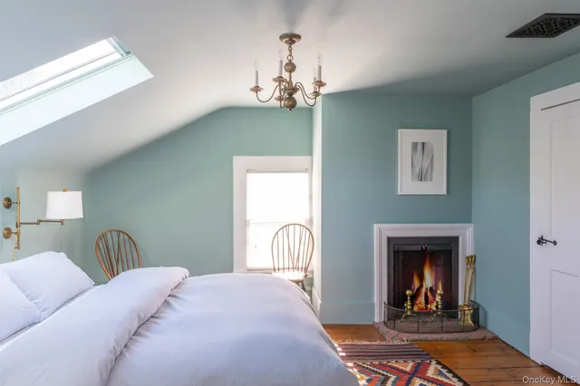 a bathroom with a mirror toilet and shower