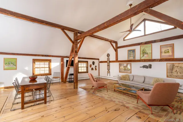 a bedroom with two beds and a window