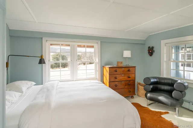 a front view of a house with a yard table and chairs