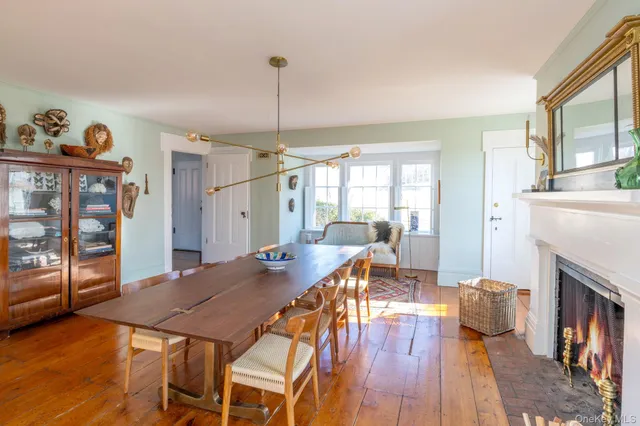 a view of a livingroom with furniture window and wooden floor