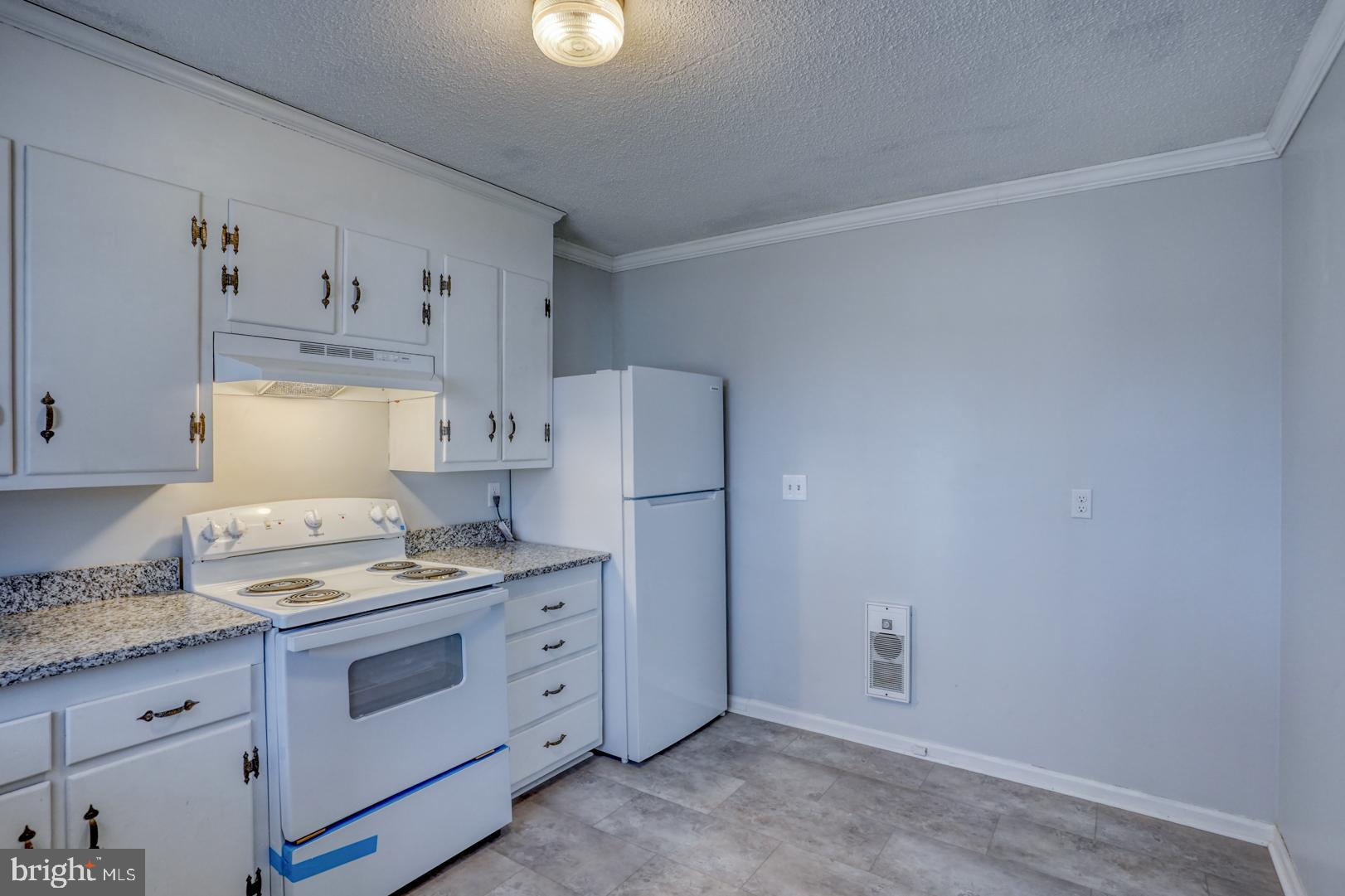 43 Cherry Drive Magnolia, DE 19962 - Photo 13 of 34 a kitchen with cabinets appliances and a counter space