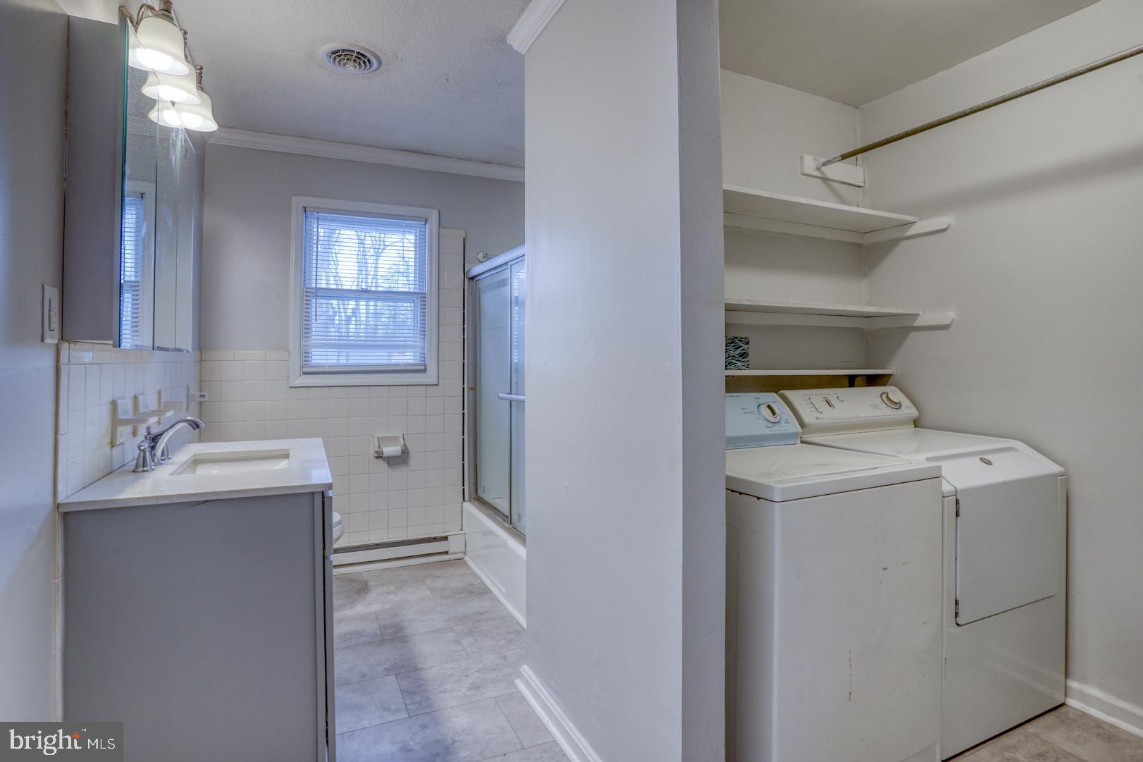 43 Cherry Drive Magnolia, DE 19962 - Photo 20 of 34 a utility room with cabinets washer and dryer