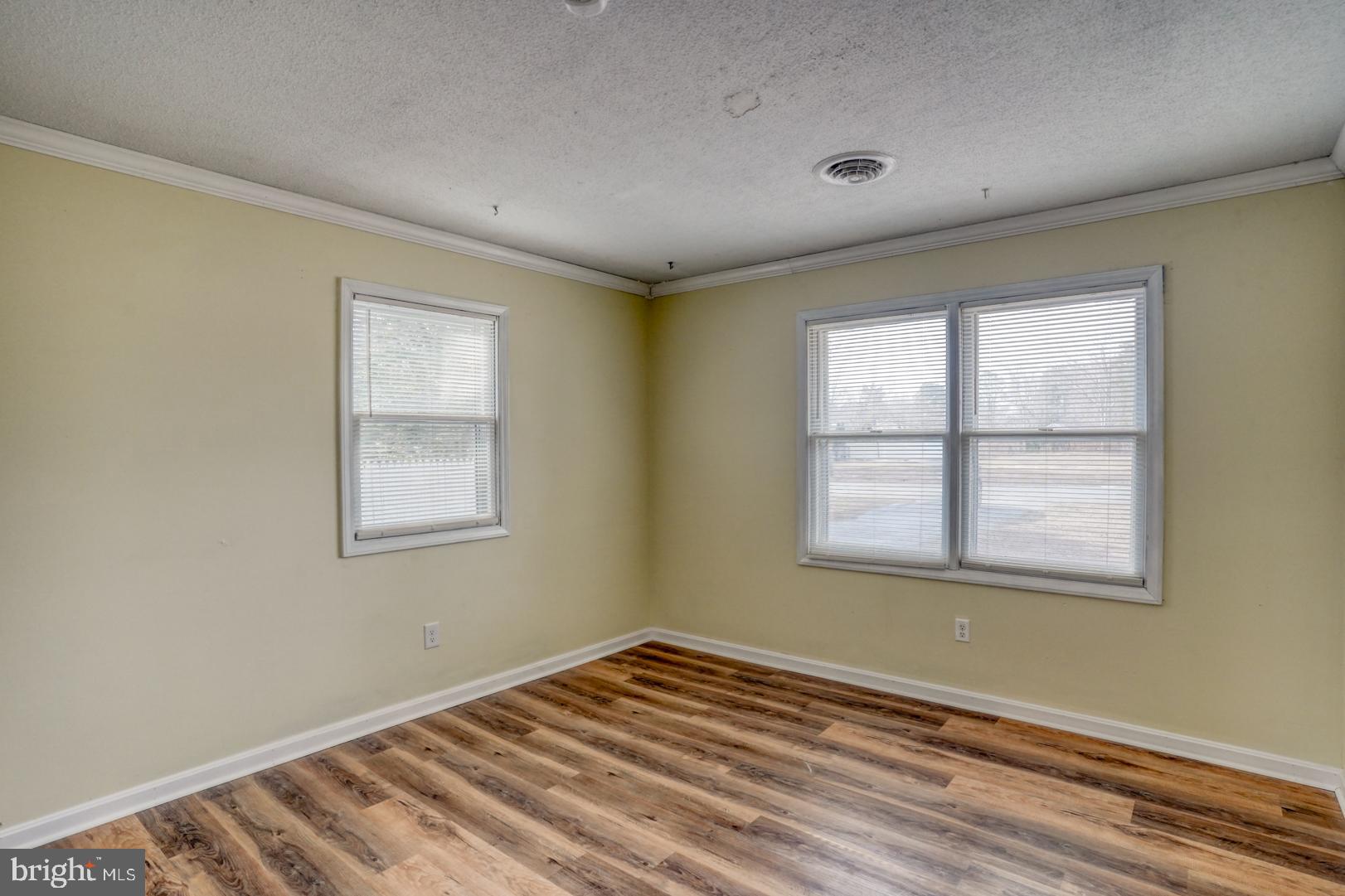 43 Cherry Drive Magnolia, DE 19962 - Photo 25 of 34 a view of an empty room with wooden floor and a window