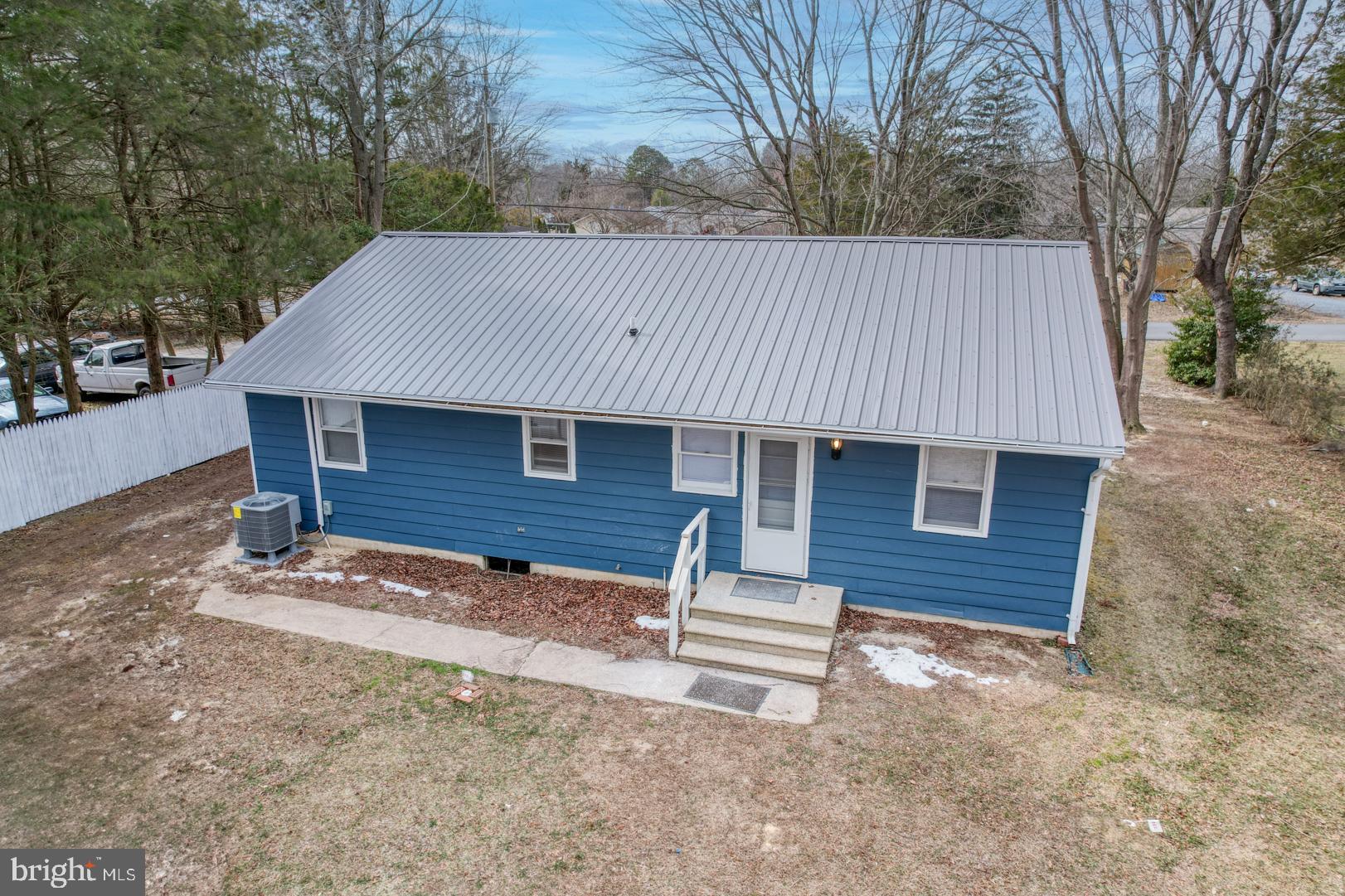 43 Cherry Drive Magnolia, DE 19962 - Photo 26 of 34 a backyard of a house with table and chairs