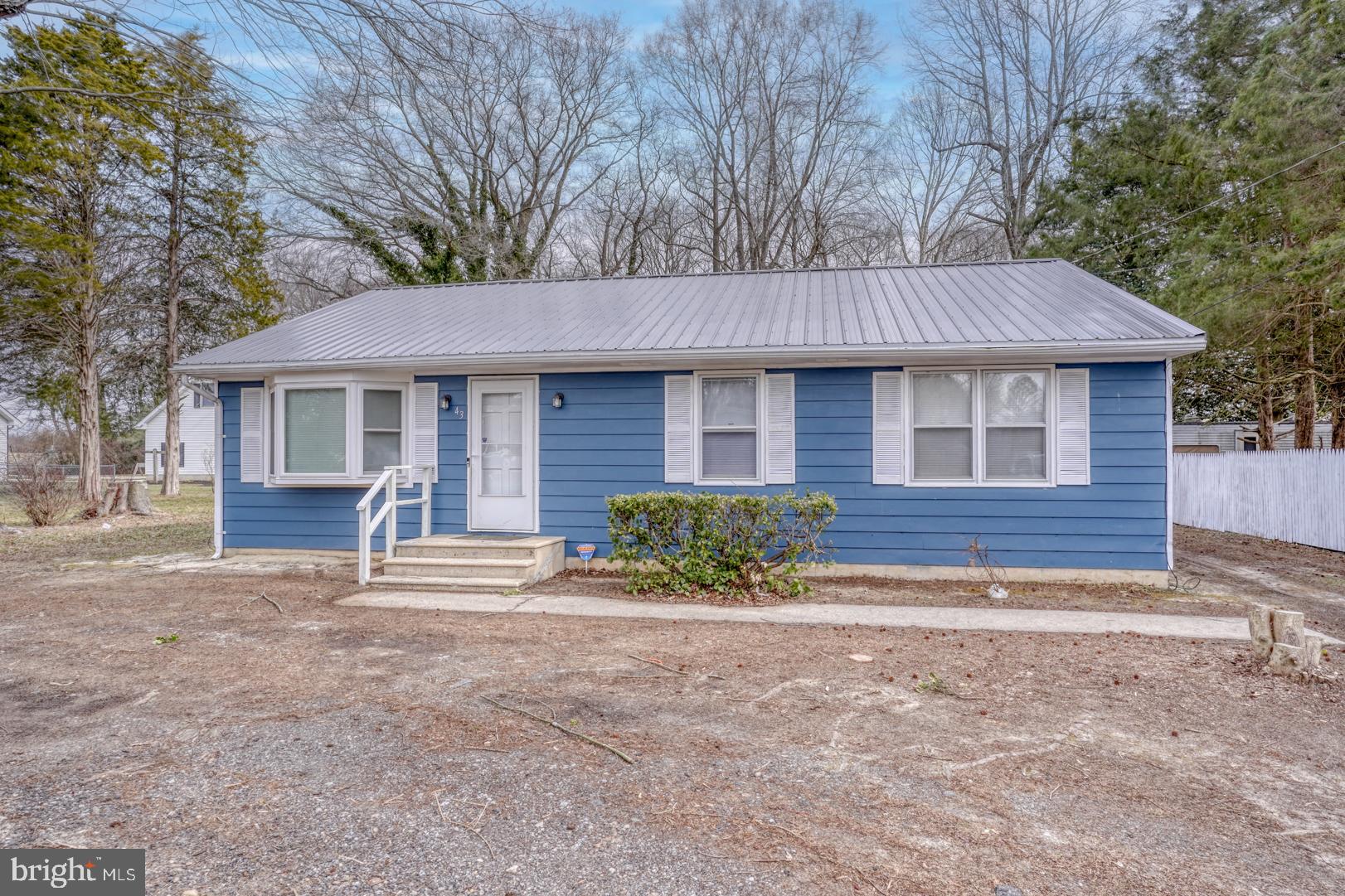 43 Cherry Drive Magnolia, DE 19962 - Photo 3 of 34 a house that has a tree in front of it