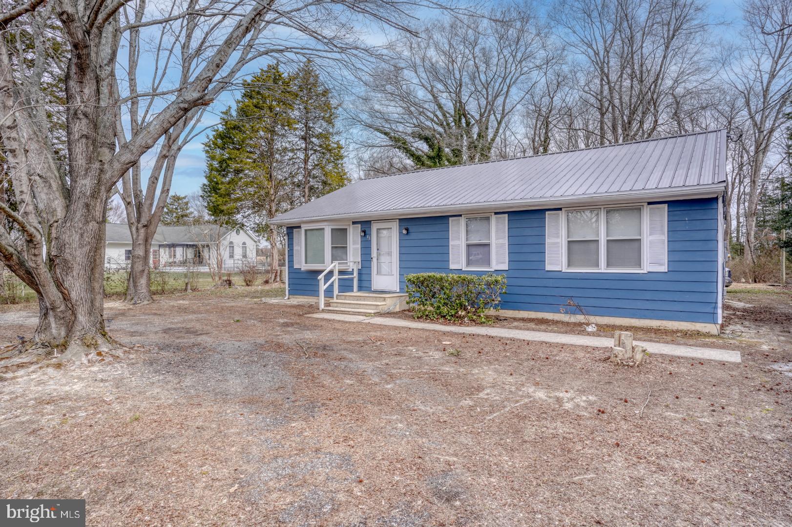 43 Cherry Drive Magnolia, DE 19962 - Photo 4 of 34 a front view of a house with garden