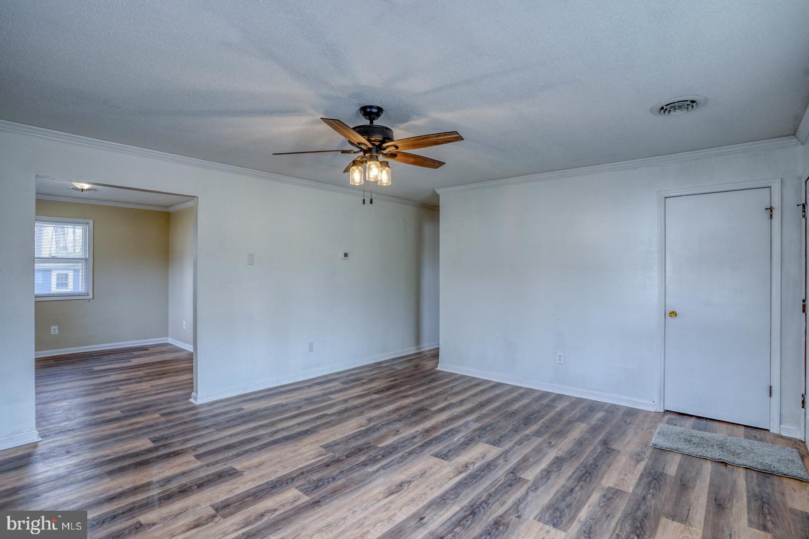 43 Cherry Drive Magnolia, DE 19962 - Photo 8 of 34 wooden floor in an empty room with a window