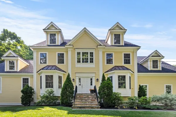 front view of a house with a yard