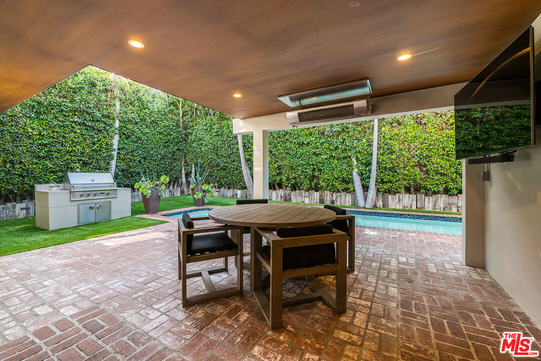 3201 Viola Place Marina del Rey, CA 90292 - Photo 23 of 72 a patio with table and chairs and potted plants