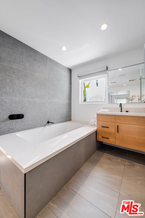 3201 Viola Place Marina del Rey, CA 90292 - Photo 44 of 72 a bathroom with a tub a sink and a window