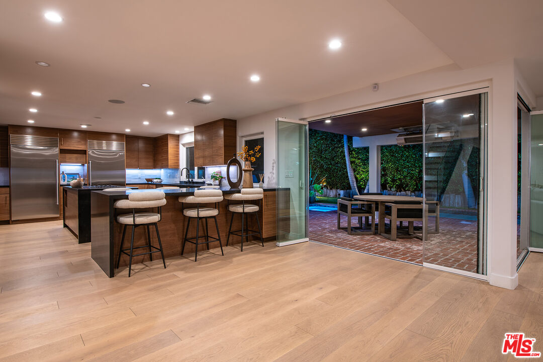 3201 Viola Place Marina del Rey, CA 90292 - Photo 68 of 72 a kitchen with a large counter top furniture and a wooden floor