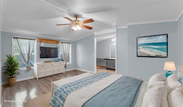 12409 Ranch Road 2341 Burnet, TX 78611 - Photo 6 of 15 a bedroom with a bed and a chandelier