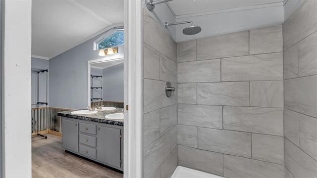 12409 Ranch Road 2341 Burnet, TX 78611 - Photo 10 of 15 a spacious bathroom with a granite countertop sink a mirror and a shower
