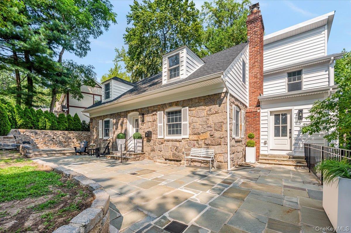 97 Station Road Great Neck, NY 11023 - Photo 1 of 1 a view of a house with outdoor seating