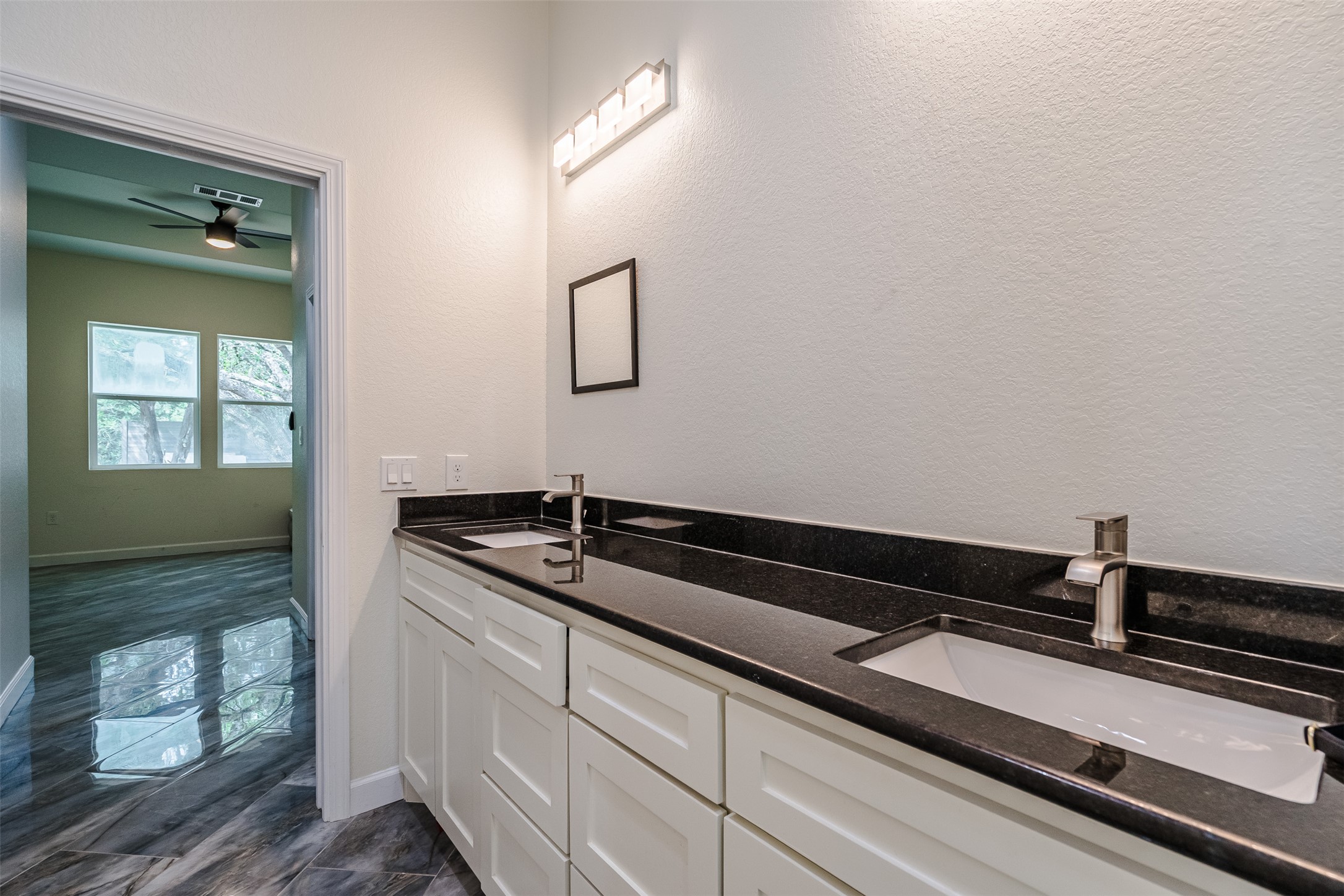 1354 Old Pin Oak Road Paige, TX 78659 - Photo 18 of 37 a bathroom with a granite countertop sink and a mirror