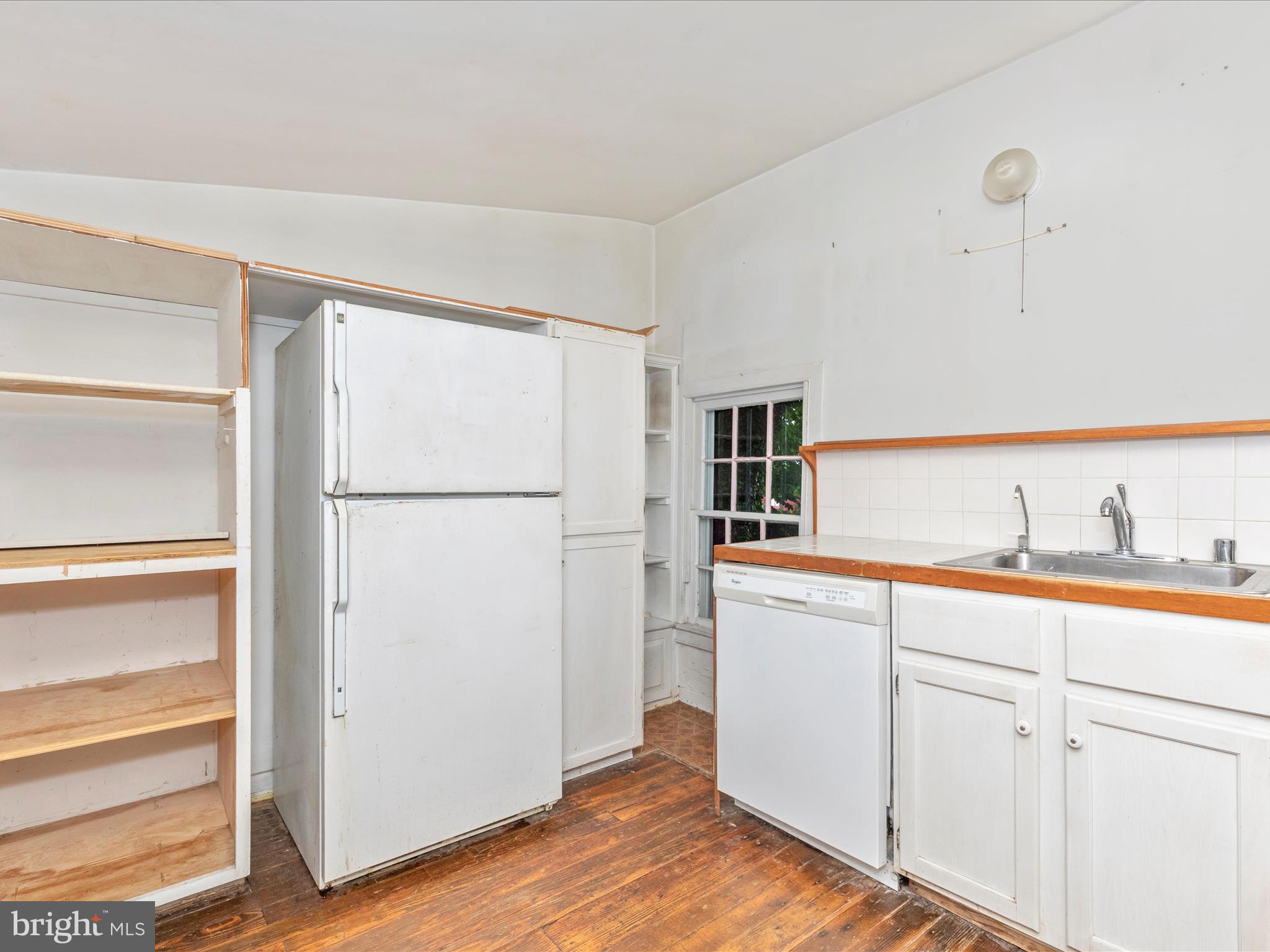 3204 Uniontown Road Westminster, MD 21158 - Photo 17 of 51 a kitchen with a refrigerator and a sink
