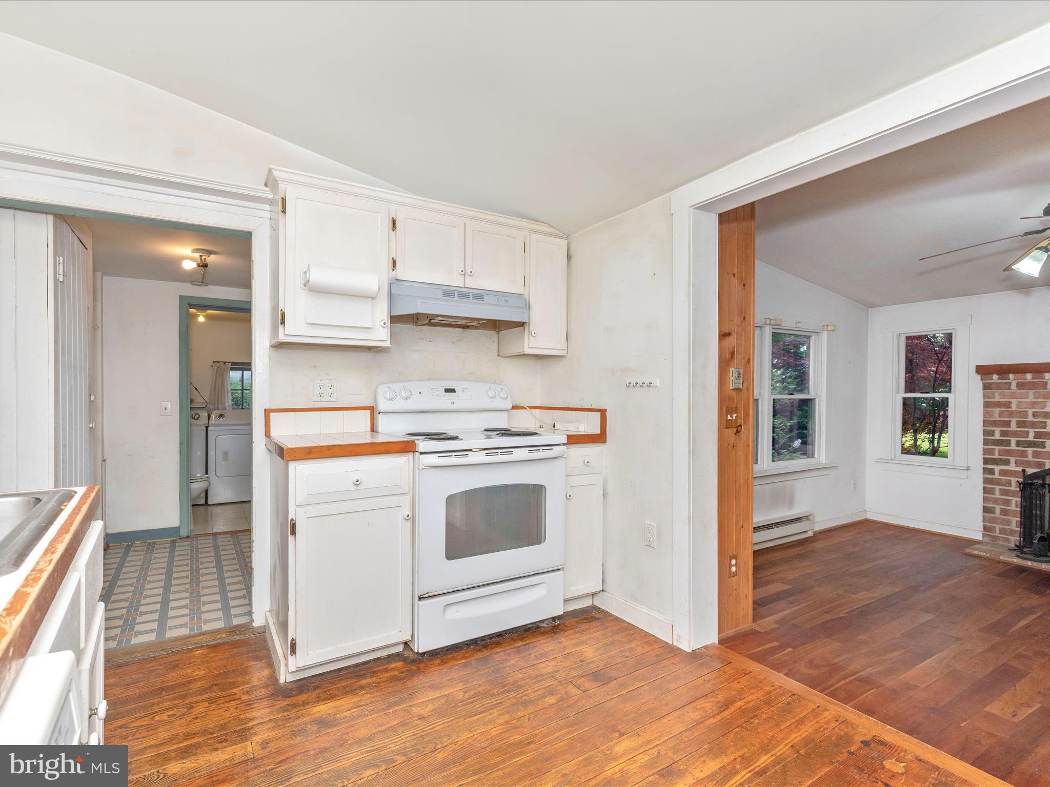 3204 Uniontown Road Westminster, MD 21158 - Photo 22 of 51 a kitchen with granite countertop a stove and a sink