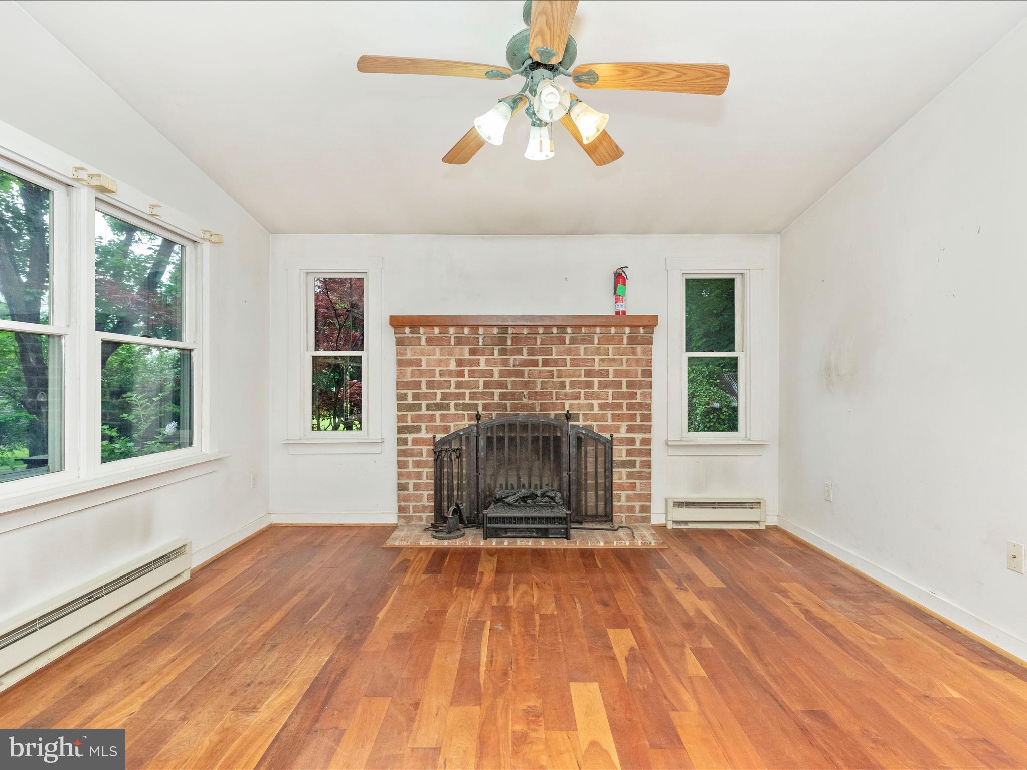 3204 Uniontown Road Westminster, MD 21158 - Photo 23 of 51 an empty room with windows and fireplace