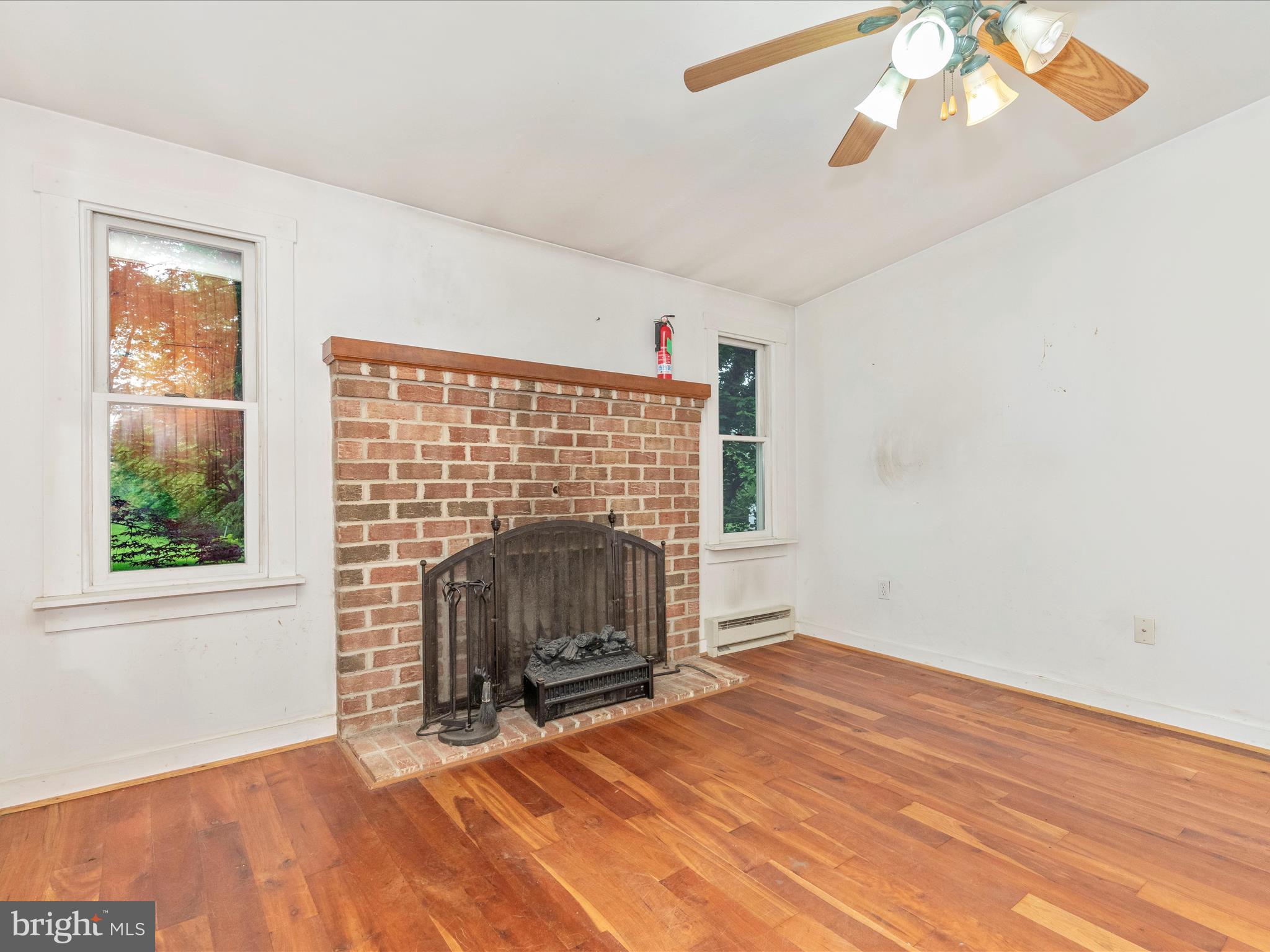 3204 Uniontown Road Westminster, MD 21158 - Photo 24 of 51 a view of empty room with fireplace and fan