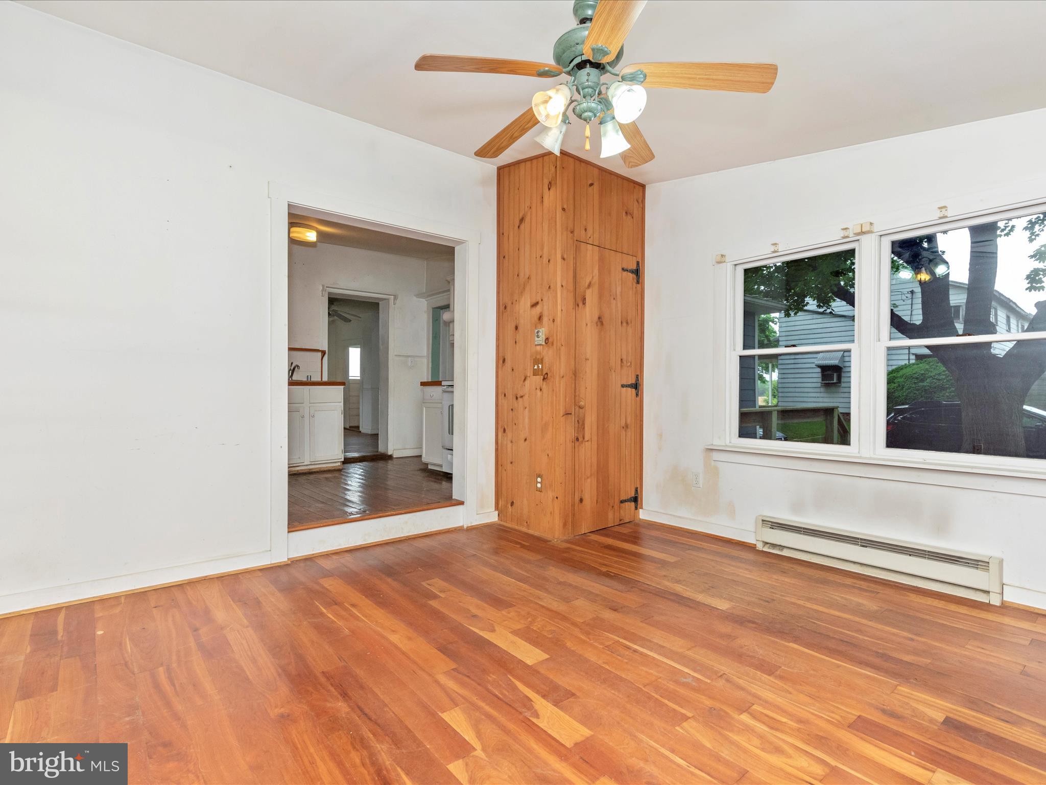 3204 Uniontown Road Westminster, MD 21158 - Photo 25 of 51 a view of an empty room with window and wooden floor