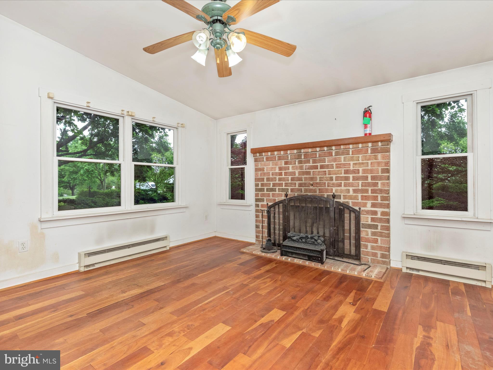 3204 Uniontown Road Westminster, MD 21158 - Photo 26 of 51 an empty room with windows and fireplace