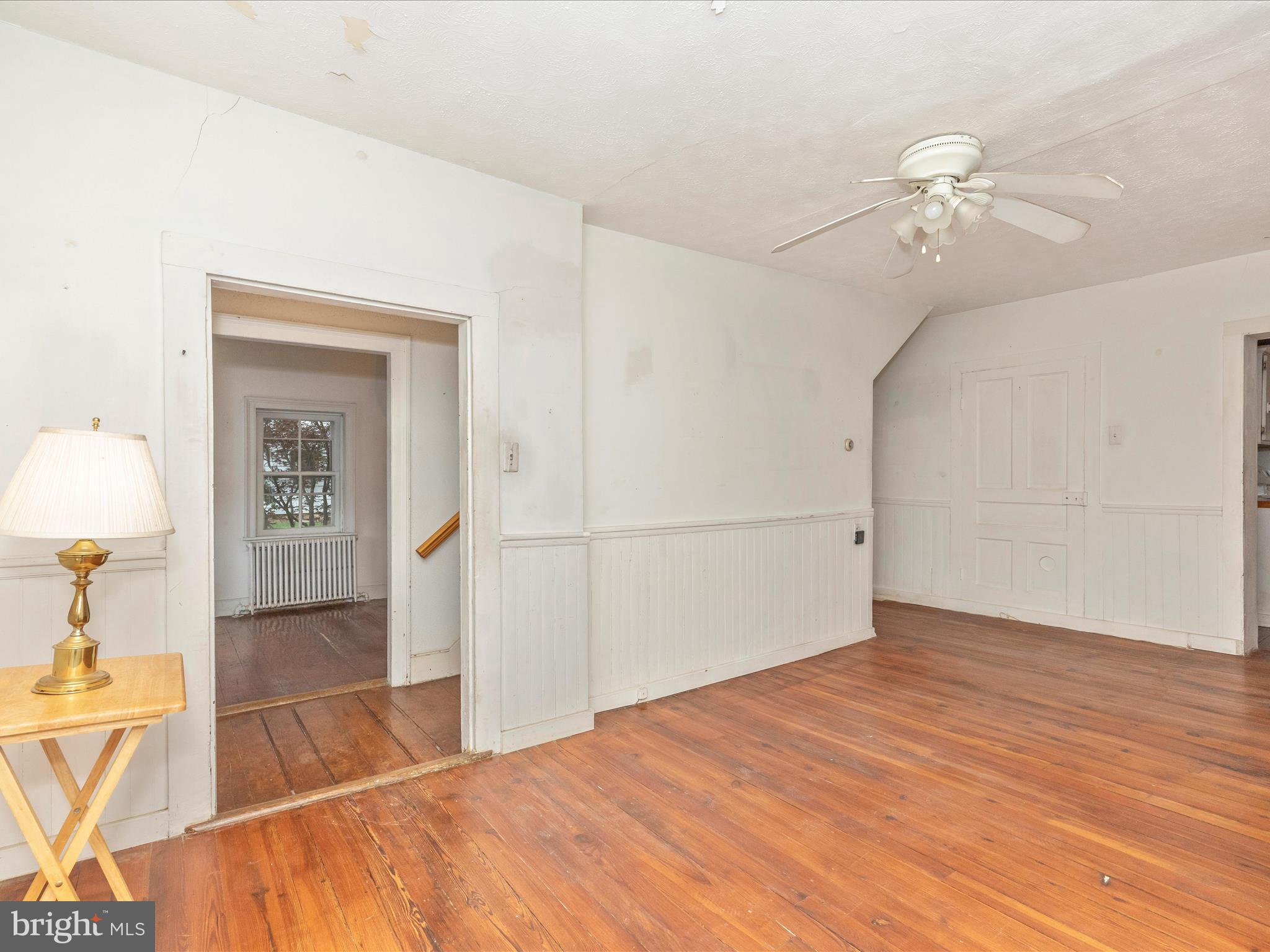 3204 Uniontown Road Westminster, MD 21158 - Photo 28 of 51 a view of a room with wooden floor and a ceiling fan