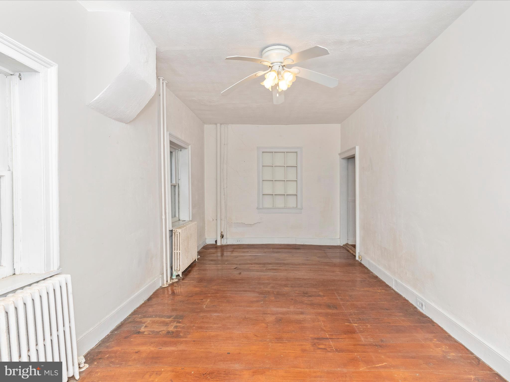 3204 Uniontown Road Westminster, MD 21158 - Photo 36 of 51 an empty room with closet and chandelier fan
