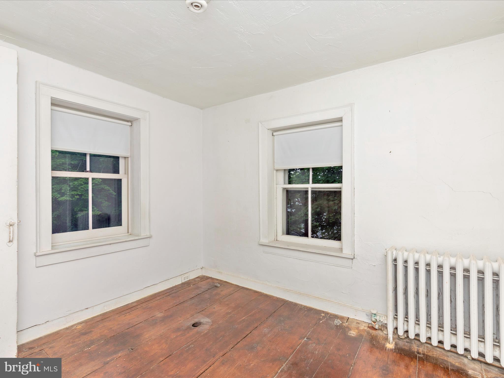 3204 Uniontown Road Westminster, MD 21158 - Photo 38 of 51 an empty room with wooden floor and windows