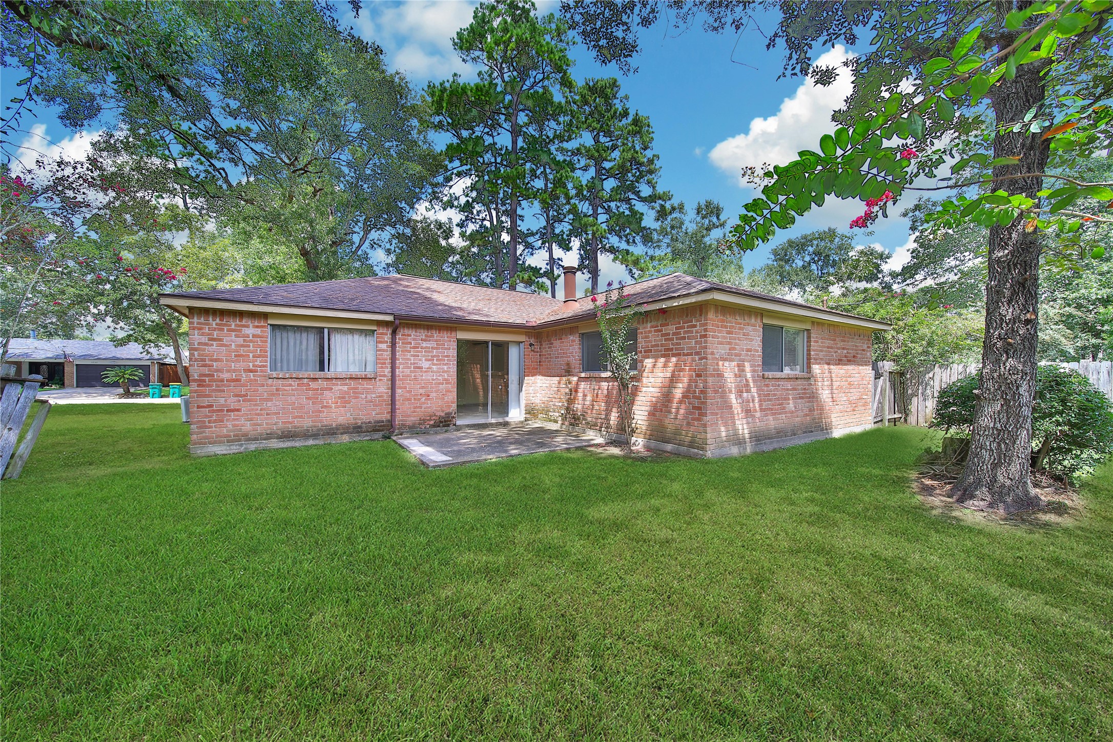 1712 Lindy Lane Conroe, TX 77301 - Photo 19 of 20 a front view of a house with garden