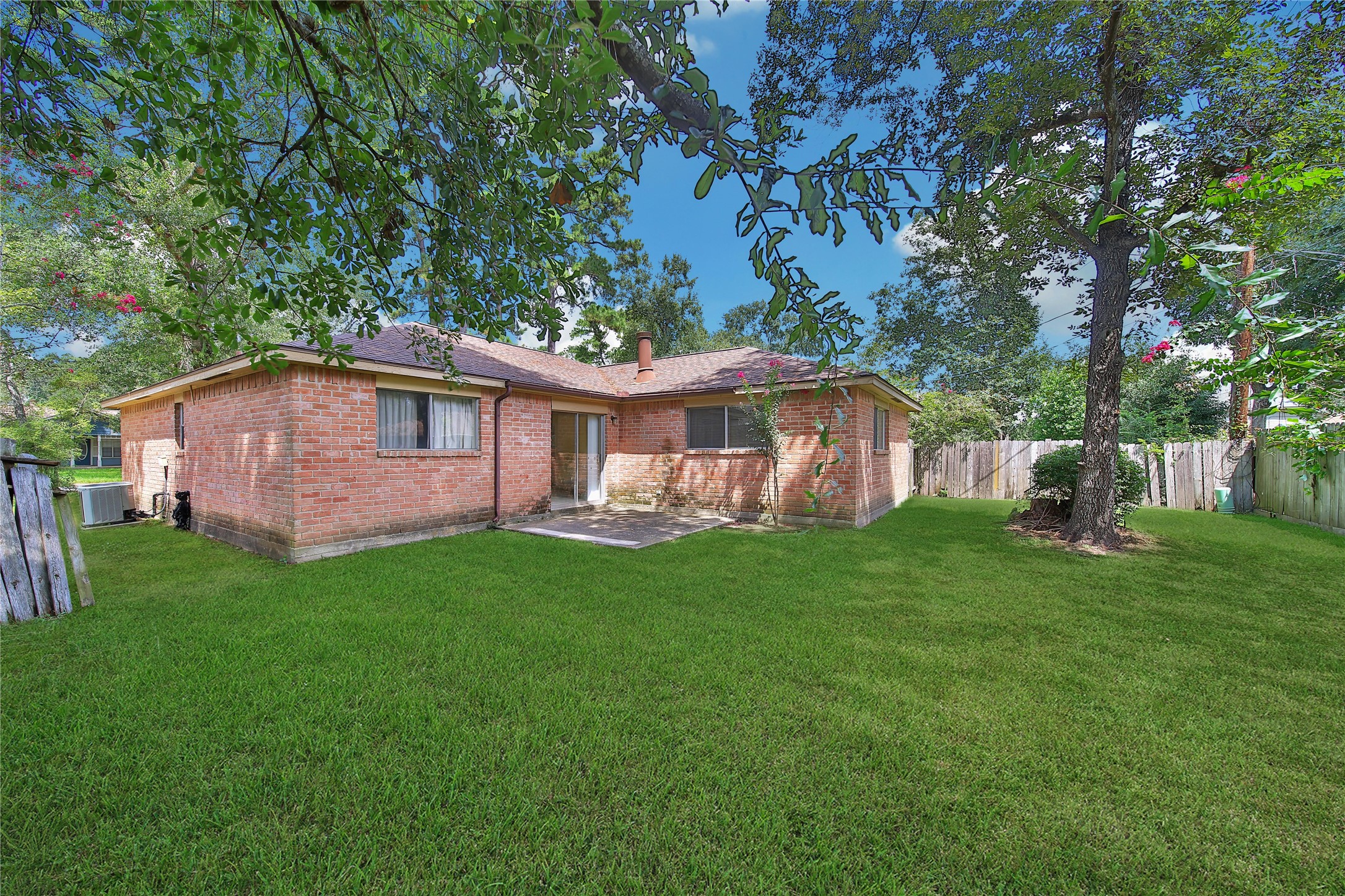 1712 Lindy Lane Conroe, TX 77301 - Photo 20 of 20 a view of a house with a backyard