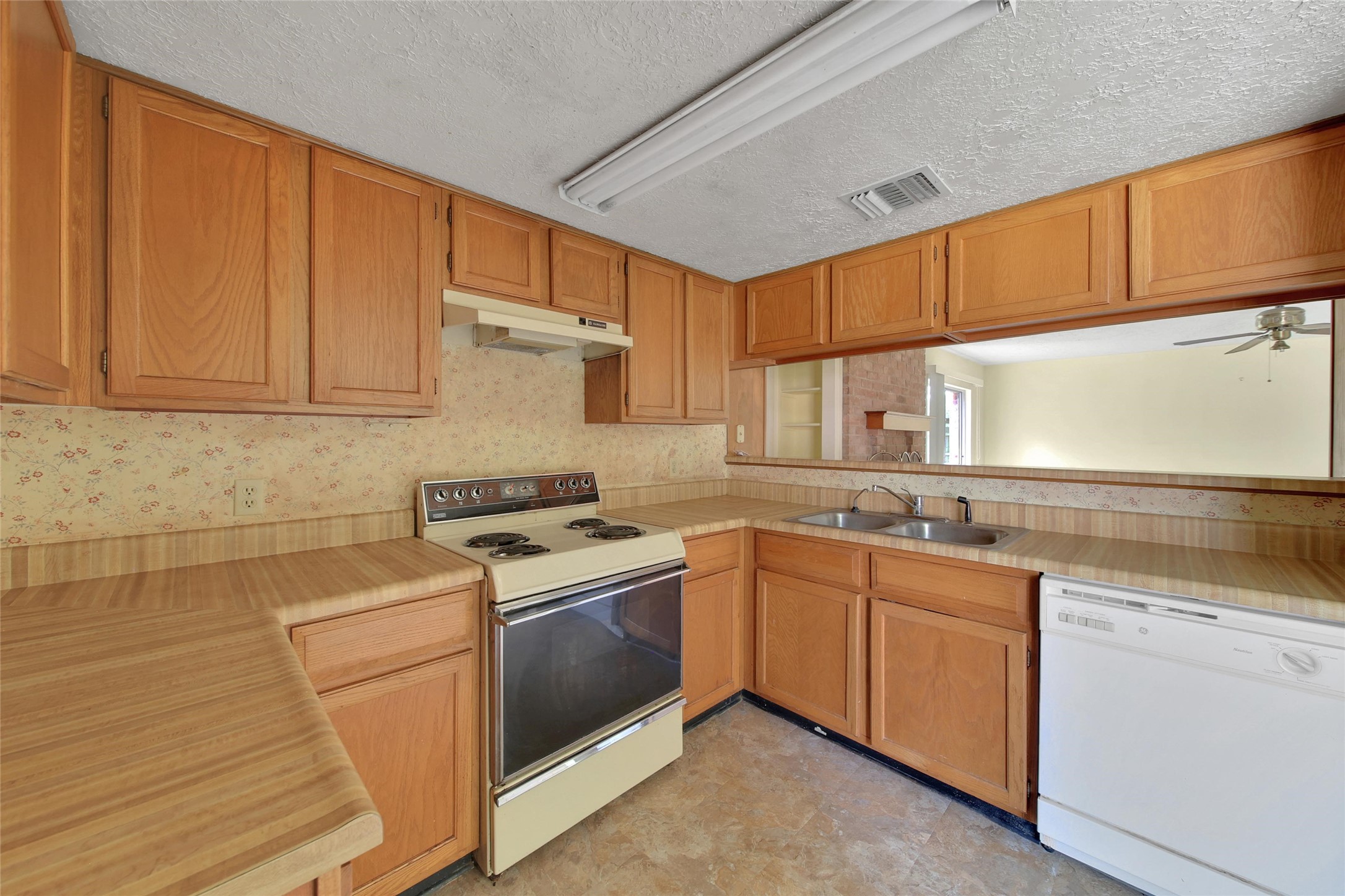 1712 Lindy Lane Conroe, TX 77301 - Photo 9 of 20 a kitchen with appliances cabinets and a sink