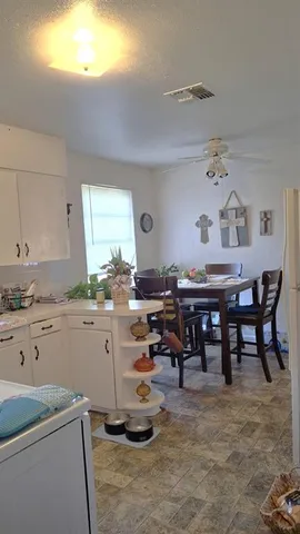 a view of dining room and kitchen