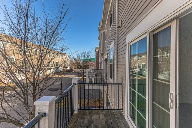 a view of a house with a big yard and a fountain