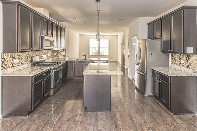 a view of a hallway to rooms