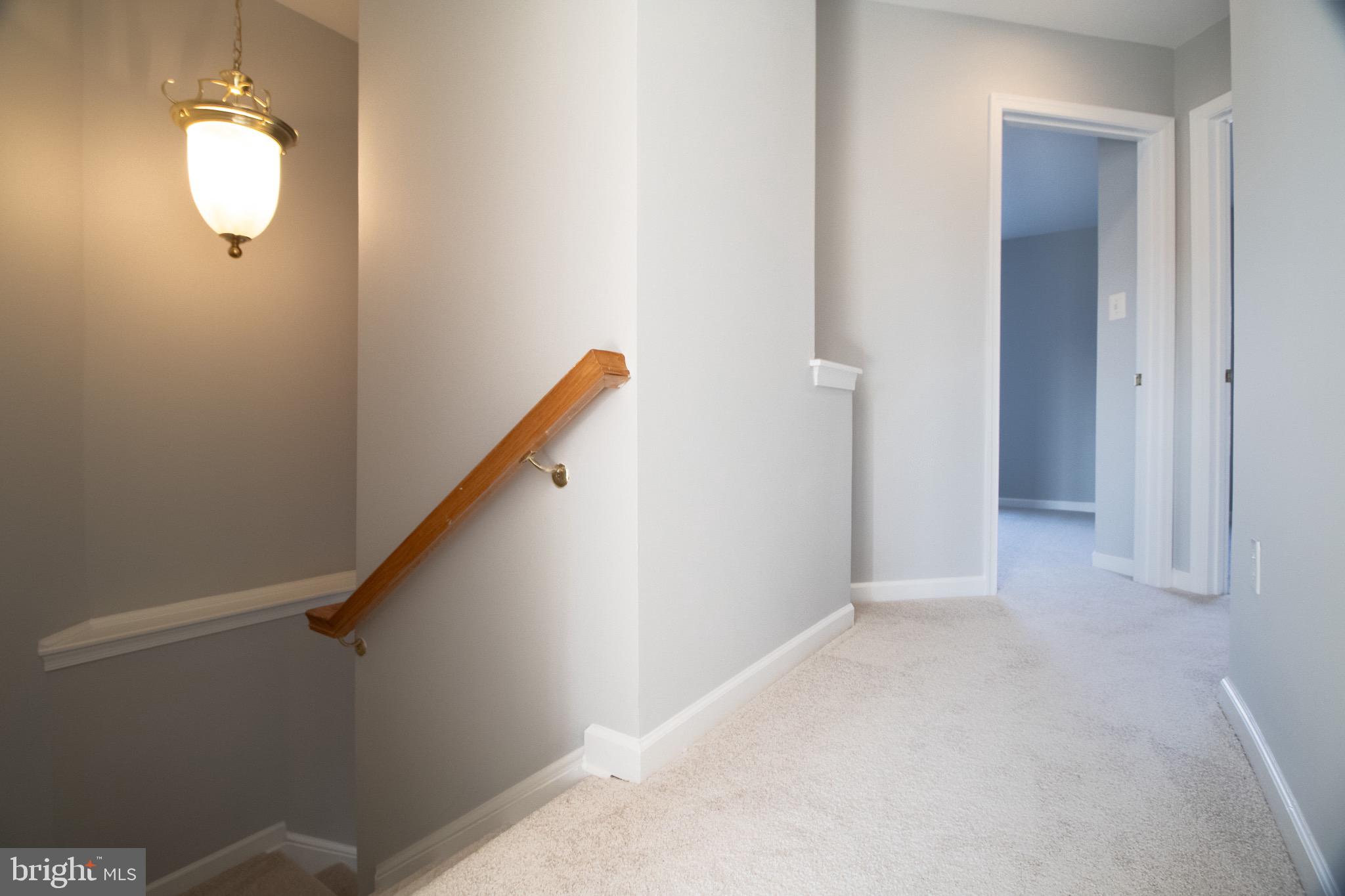 98 Lullwater Way Falling Waters, WV 25419 - Photo 20 of 43 a view of a hallway with staircase