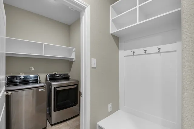 a kitchen with stainless steel appliances a white stove and a refrigerator