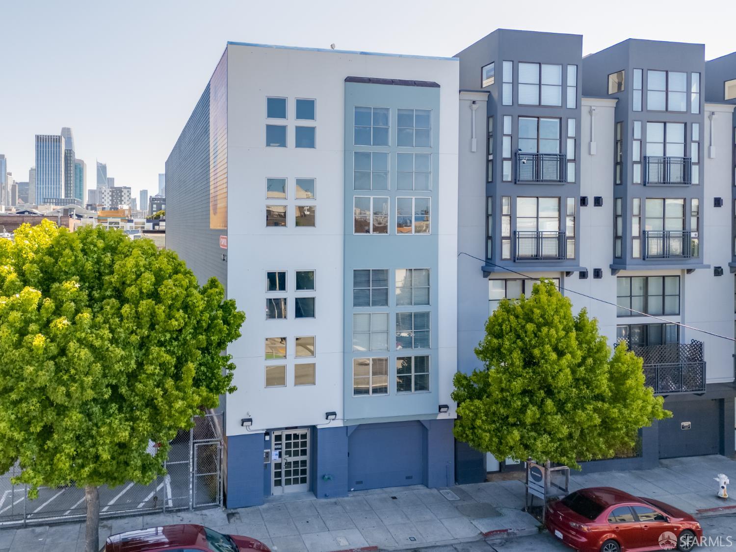 a view of a building and front yard